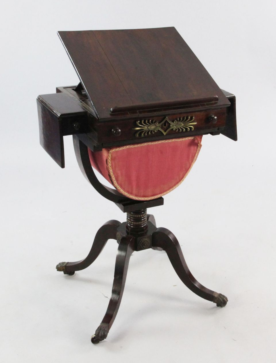 An early 19th century rosewood games / work table, the sliding hinged top revealing a backgammon
