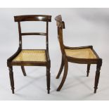 A set of six early 19th century rosewood dining chairs, with shaped crest rails and caned seats,