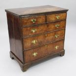 An 18th century walnut chest, of two short and three long graduated drawers, on bracket feet, W.