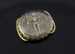 A late 17th century gold mounted stuart crystal mourning slide, of oval form, depicting a skeleton