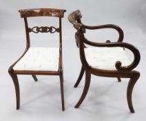 A harlequin set of six Regency mahogany dining chairs, with pierced shaped spar backs and diaper