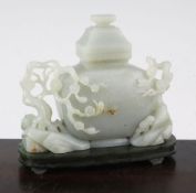 A Chinese pale celadon jade vase and cover, with spinach green jade stand, Qing dynasty or later,