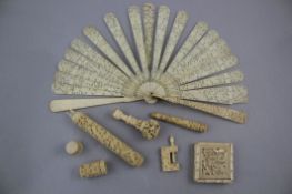 A group of Chinese export ivory items, 19th century, all carved in relief with either figures,