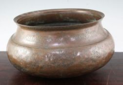 An early 17th century Safavid copper bowl, engraved with typical decoration, 14in.