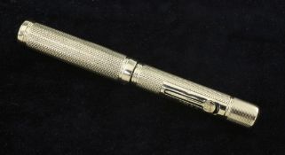 A small 9ct gold Waterman's Ideal fountain pen, with engine turned decoration, 3.75in.