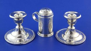 An Edwardian silver pepper pot by Edward Barnard & Sons Ltd, of domed cylindrical form, with