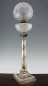 An Edwardian silver corinthian column table oil lamp, (now converted to electricity), with cut glass
