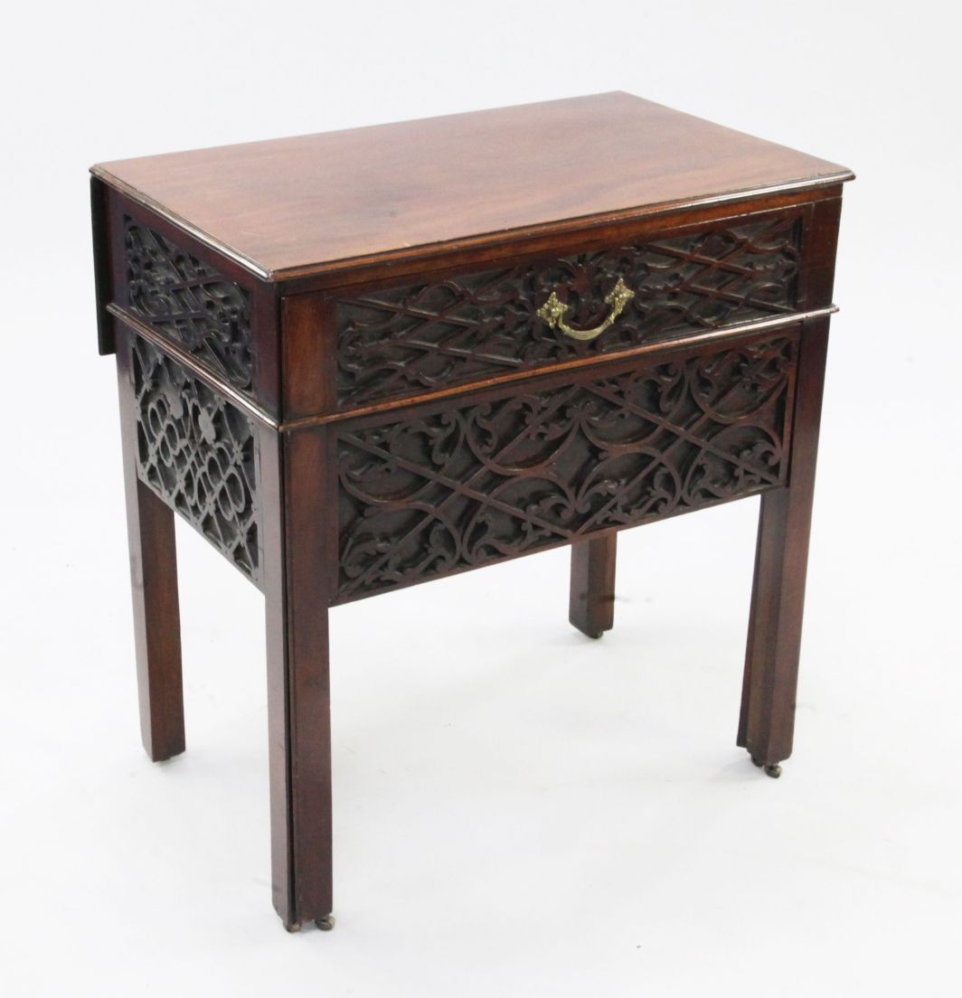 A George III mahogany architect's table, the top with single drop leaf above blind fret carved