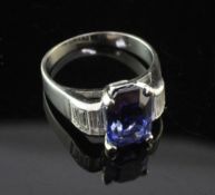 A platinum, sapphire and diamond ring, the emerald cut sapphire of good colour and weighing