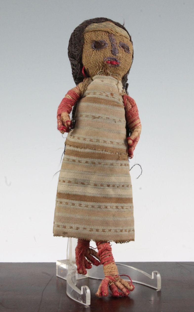 A Peruvian Chancay woven cloth doll, believed to be pre-Columbian in origin, 12in.Note: Given as a