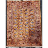 A Bokhara carpet, with field of thirty six polygons, on a burnt orange ground, with three row