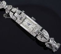 A lady's 1930's/1940's platinum and diamond cocktail watch, with rectangular Arabic dial, the case