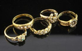 Two late Victorian 15ct gold and split pearl set rings, two similar split pearl and diamond rings,