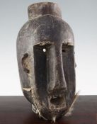 A West African carved hardwood wall mask, with stylised features, 15in.