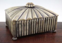 An Anglo Indian buffalo horn work box, the hinged lid with stylised flowerhead finial opening to