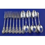 A set of six early 20th century German 800 standard silver fancy pattern dessert forks and six