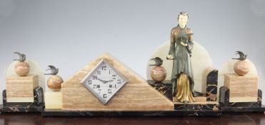 A French Art Deco onyx, marble and patinated metal clock garniture, with silvered lozenge shaped