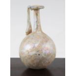 A Roman glass flask, c. 2nd century A.D., with mineral iridescence, globular body and looped handle,