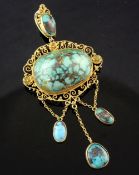 An early 20th century 15ct gold filigree and turquoise drop pendant, with pierced scroll setting,