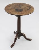 A George III mahogany circular tripod table, with central tapering column and downswept supports