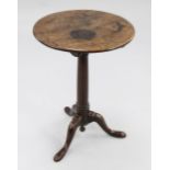 A George III mahogany circular tripod table, with central tapering column and downswept supports