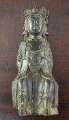 A Chinese late Ming bronze figure of a Buddhist saint or immortal, early 17th century, in seated