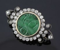 A late Victorian jadeite and diamond set brooch, with monogram en verso, the circular jade plaque