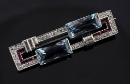 A 1930's/1940's Art Deco platinum, aquamarine, synthetic ruby? and diamond set bar brooch, of