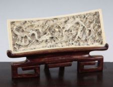 A Chinese ivory 'dragon' plaque, early 20th century, carved in high relief with two confronting