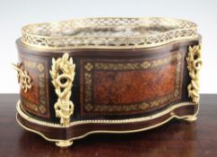 A 19th century French ormolu mounted serpentine jardiniere, with amboyna panels decorated with brass