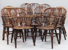 A harlequin set of thirteen early 19th century yew, elm and ash Windsor elbow chairs, the hoop backs