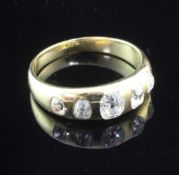 A late Victorian gold and gypsy set five stone diamond ring, set with five graduated old mine cut