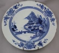 A large Chinese export blue and white dish, Qianlong period, painted to the centre with figures on a