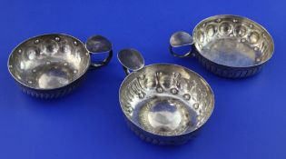 Three late 19th/early 20th century French 950 standard silver taste vin, two with engraved initials,