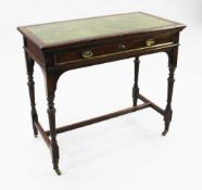 A late 19th century mahogany writing table, by Gillows, with inset green leather writing surface