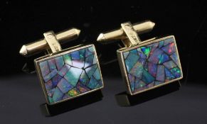 A pair of 18k gold and opal doublet cufflinks, of rectangular form, each set with opal segments,