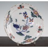 A Delft pottery dish, second quarter 18th century, painted with Chinese style polychrome flowers and