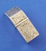 An early Victorian silver sealing wax holder, with engraved foliate decoration and slanted lid