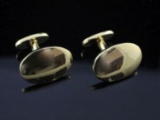 A modern pair of Tiffany & Co 18ct gold oval cufflinks, with pouch and box, 14 grams.