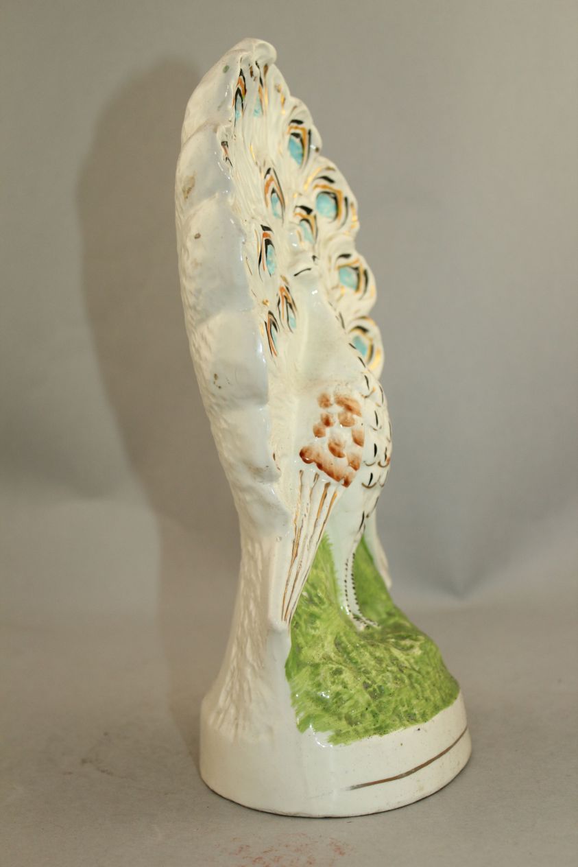 An unusual Staffordshire pottery flatback peacock figure, mid 19th century, the plumage of the - Image 5 of 6