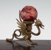 A Galle cameo glass shade, with a brass 'dragon' lamp base, c.1910, the globular shade with pink