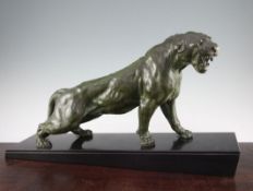 After Thomas Francois Cartier (1879-1943). A French Art Deco green patinated model of a snarling