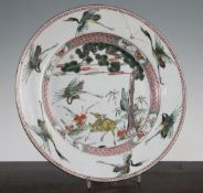 A Chinese famille verte 'deer and crane' dish, Kangxi period, painted to the centre with a