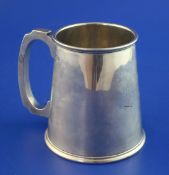 A George V silver mug, of tapering form, with engraved inscription, Aaron Lufkin Dennison,
