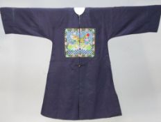 A Chinese midnight blue silk brocade robe for a military official of the 4th rank, with dragon