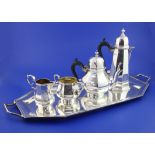 A matched George V 18th century design silver five piece tea set, of panelled form, comprising