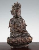 A Chinese late Ming bronze seated figure of a Bodhisattva, and stand, 16th / 17th century, the