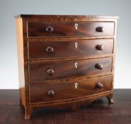 A 19th century mahogany apprentice piece bowfront chest, of four long graduated drawers with bun