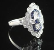 An Art Deco style 18ct white gold, sapphire and diamond cluster ring, size P.