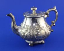 A Victorian Scottish silver teapot, of baluster form, embossed with roses amongst scrolls, with